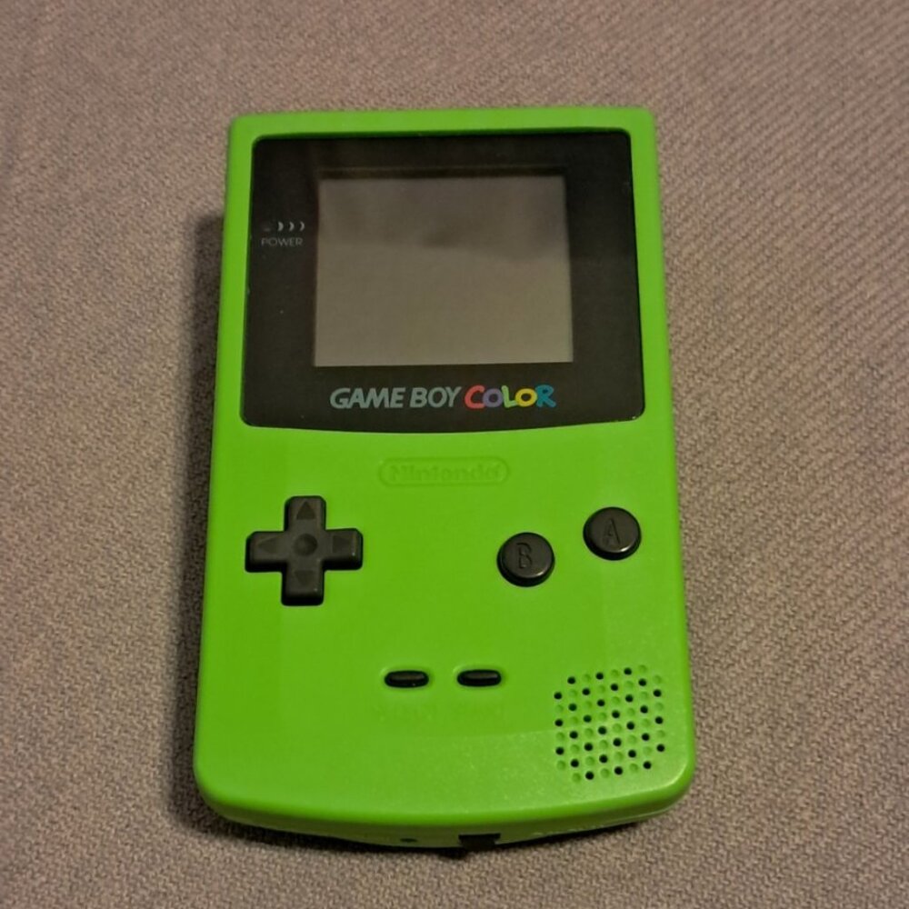 Gameboy Color, Green with glass screen, Pokemon game, and Pokemon carrying case.